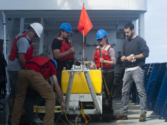 UCSB Marine Geophysicists break down an ocean bottom seismic instrument that had been sitting on the seafloor for a year.